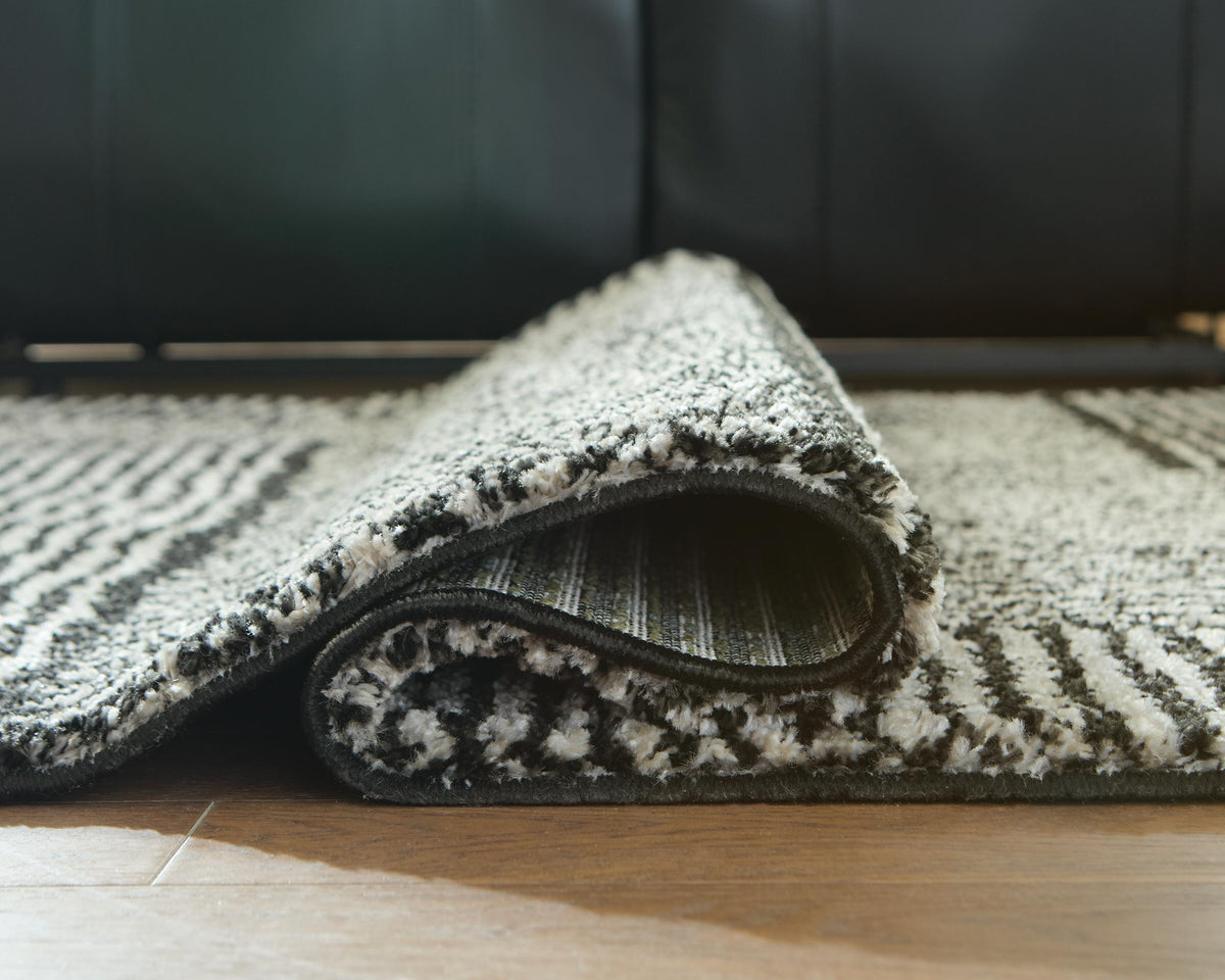 Kurtmen 5' x 7' Area Rug in Black/Ivory, detail view