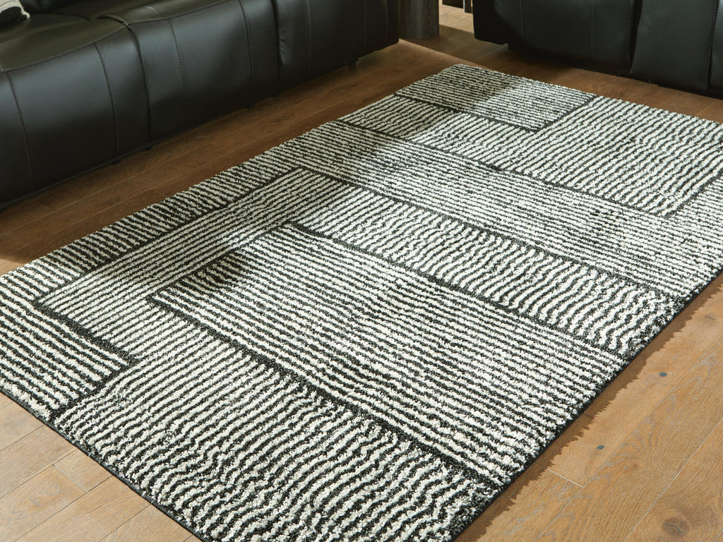 Kurtmen 5' x 7' Area Rug in Black/Ivory, lifestyle view
