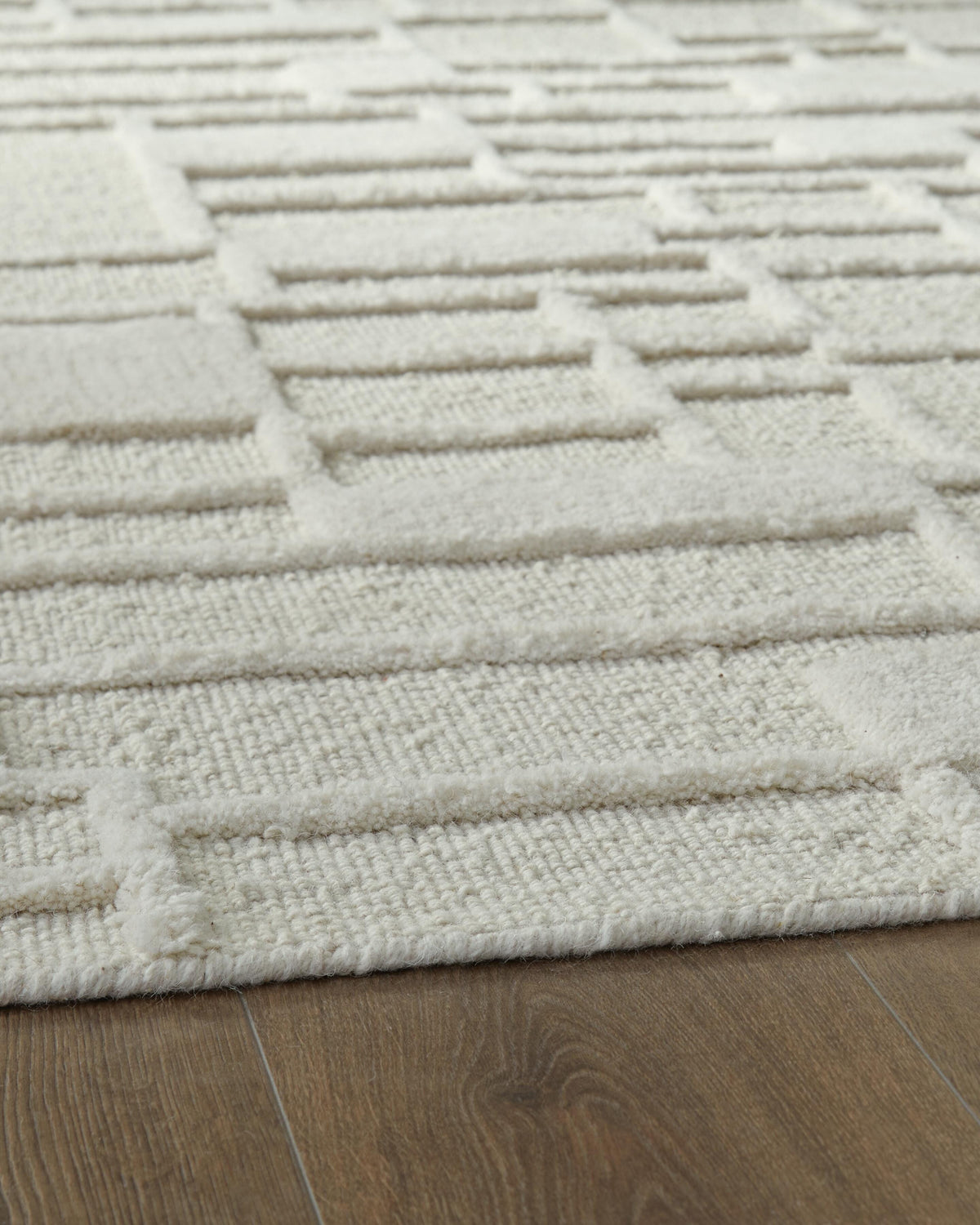 Empriss 5' x 7' Area Rug in Ivory, detail view