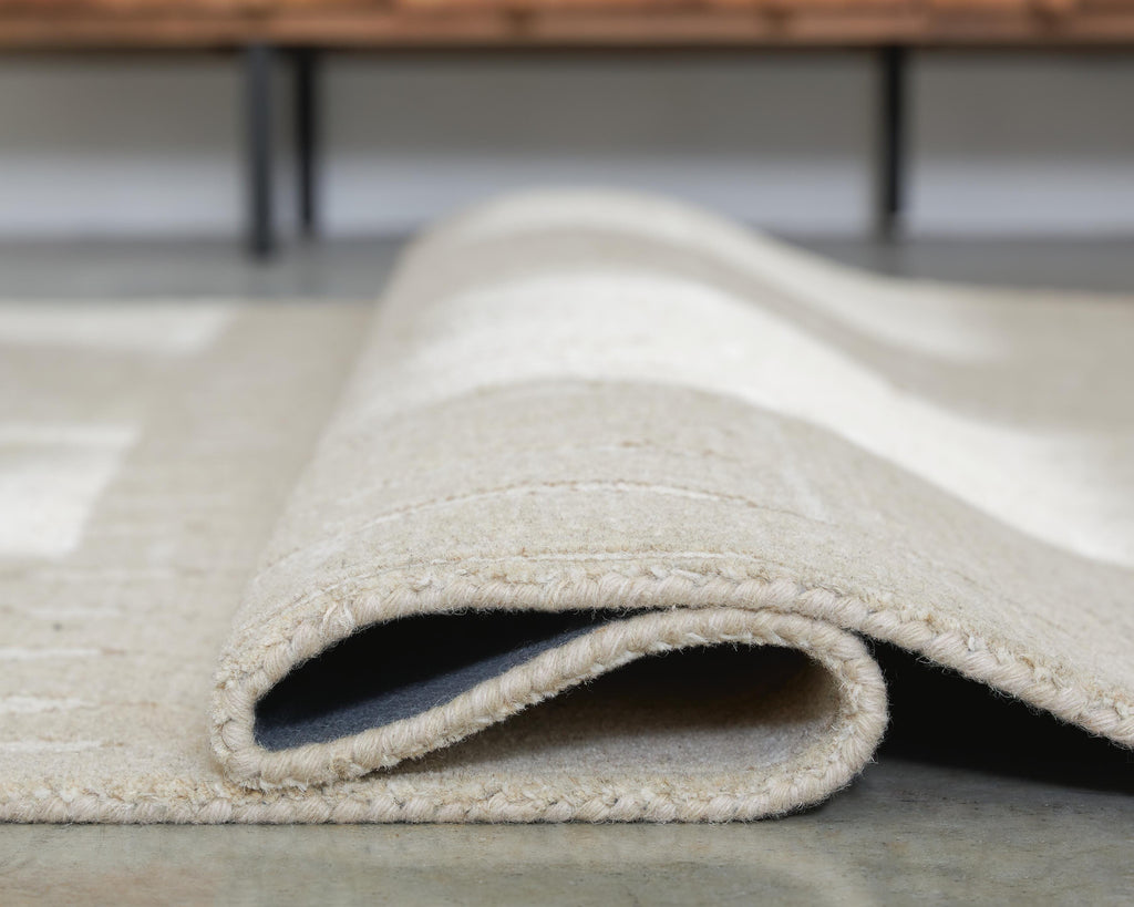 Wolbert 5' x 7' Area Rug in Tan/Ivory, detail view