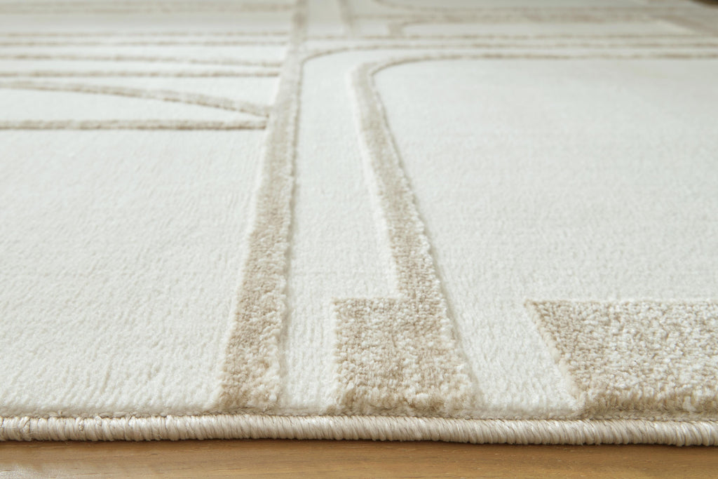 Farongrove 5'3" x 7' Area Rug in Ivory/Beige, detail view