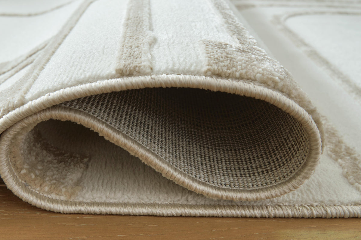 Farongrove 5'3" x 7' Area Rug in Ivory/Beige, detail view