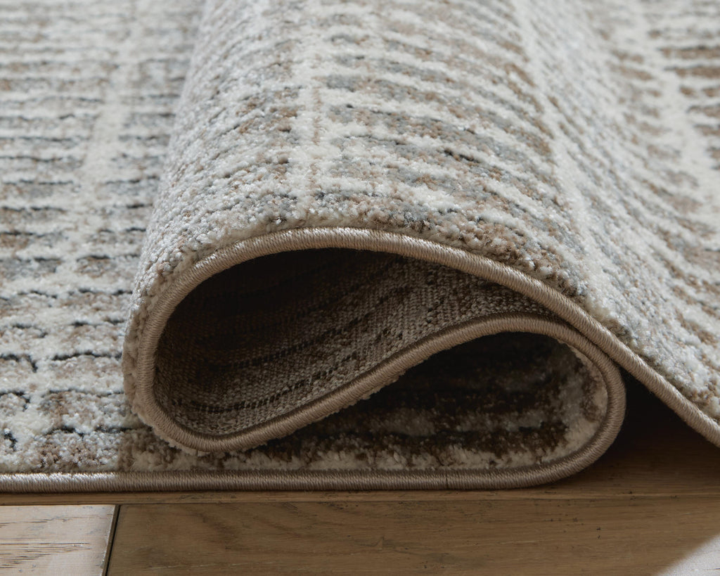 Fuadwick 5'3" x 7' Area Rug in Multi, detail view