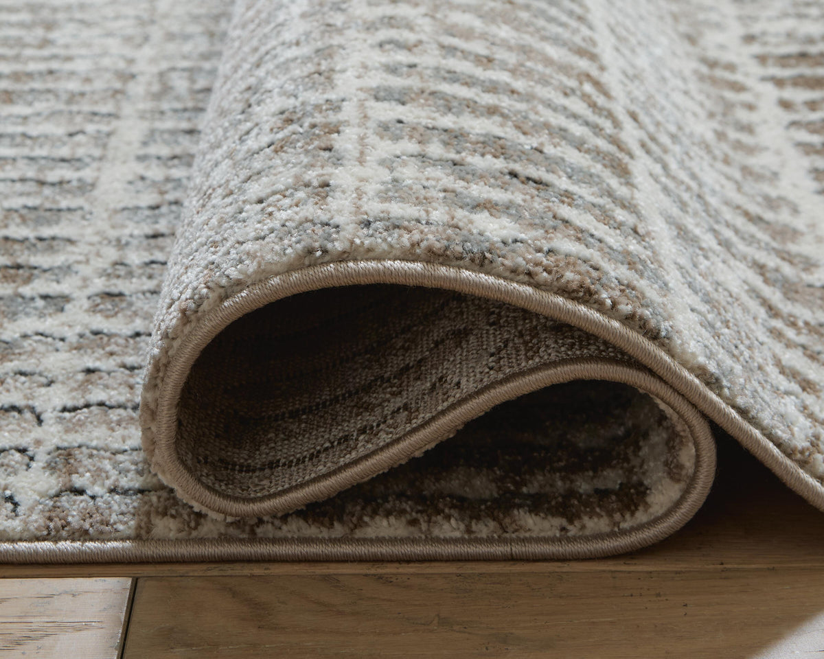 Fuadwick 5'3" x 7' Area Rug in Multi, detail view