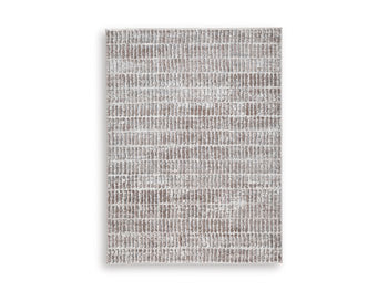 Fuadwick 5'3" x 7' Area Rug in Multi