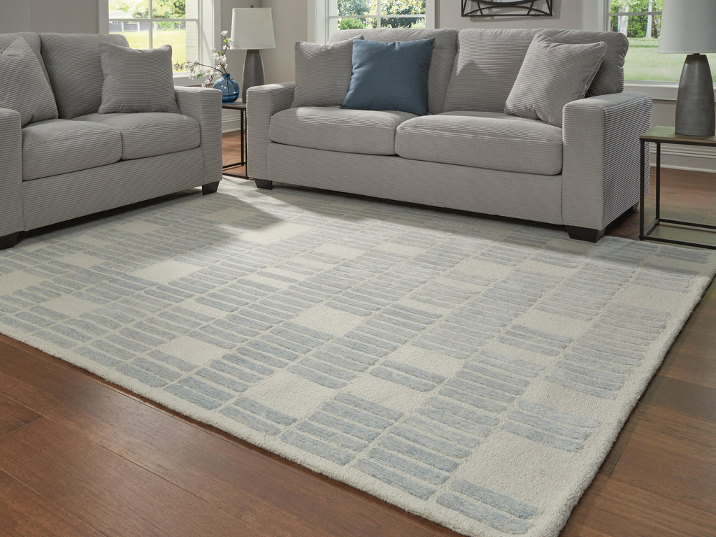 Dylanton 7'8" x 10' Area Rug in Ivory/Blue, lifestyle view