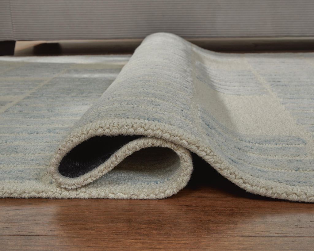 Dylanton 5' x 7' Area Rug in Ivory/Blue, detail view