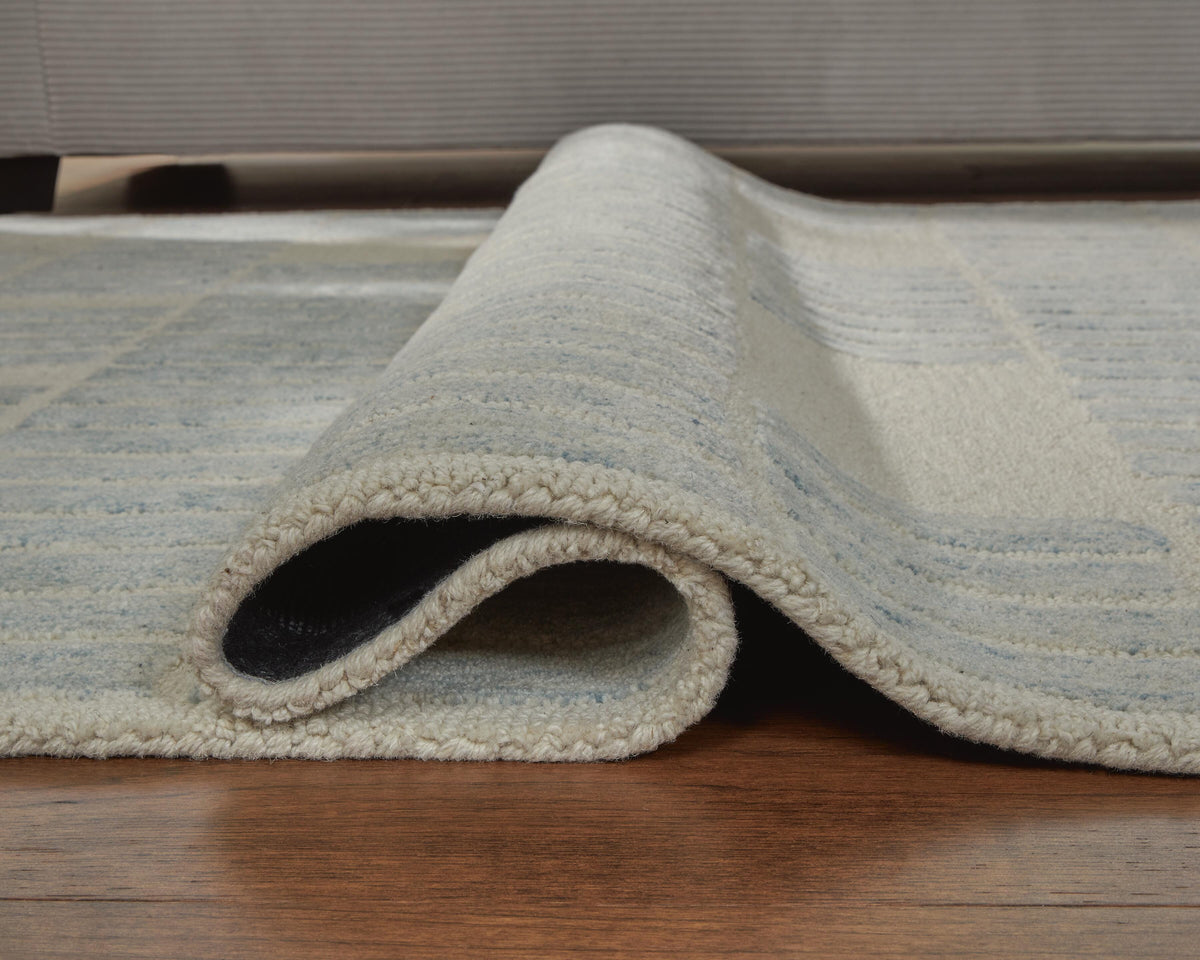 Dylanton 5' x 7' Area Rug in Ivory/Blue, detail view