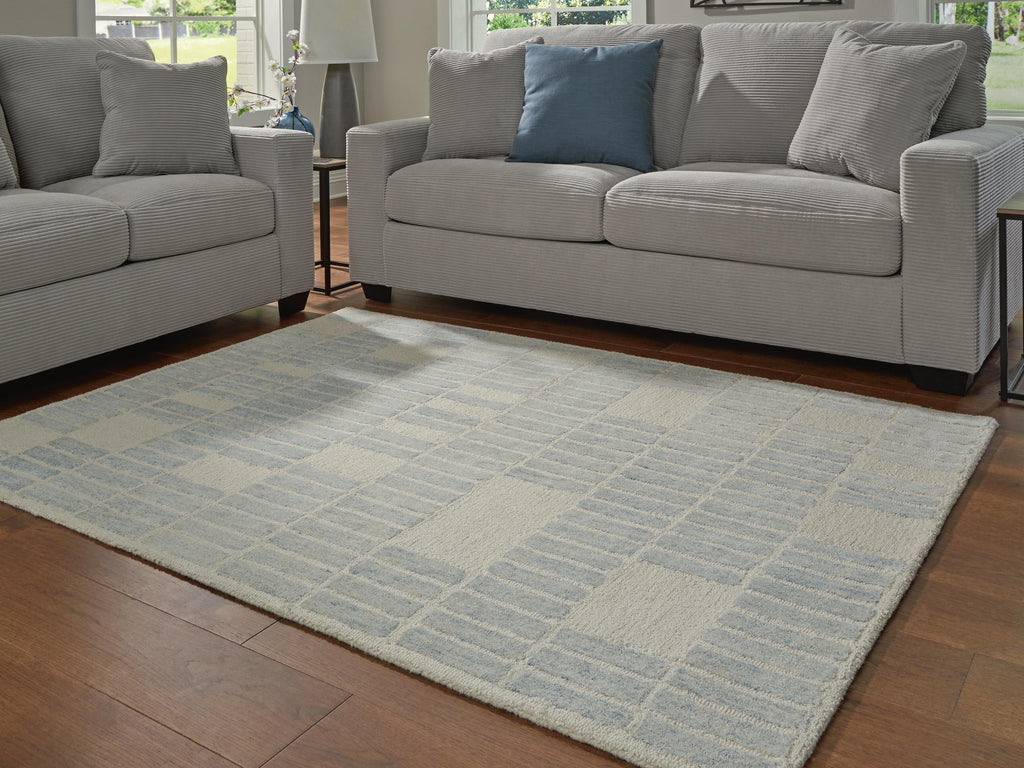 Dylanton 5' x 7' Area Rug in Ivory/Blue, lifestyle view
