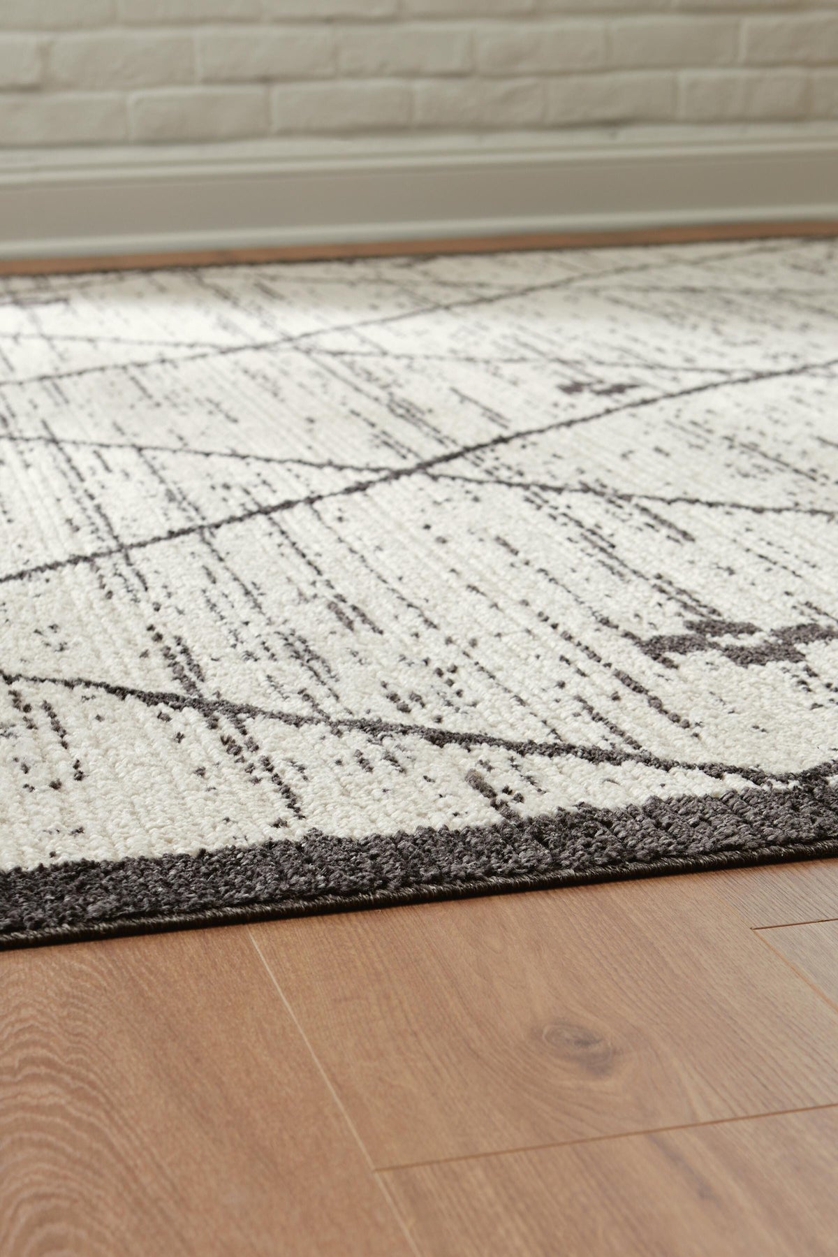 Fenriston Medium Rug in Cream/Black, detail view