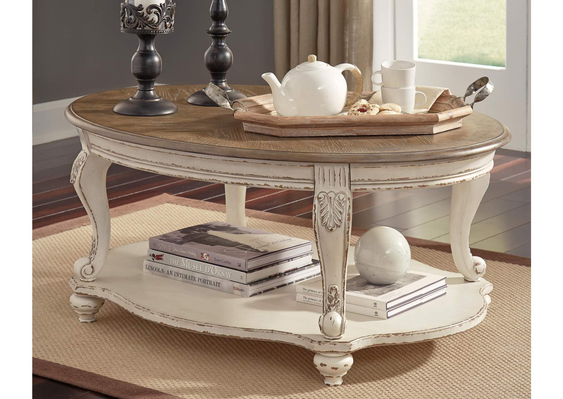 Realyn Coffee Table with 1 End Table room view